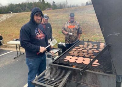 volunteers grilling for the fall fest