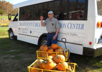 resident with pumpkins