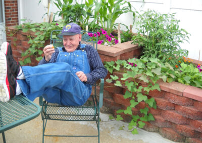 resident with his feet up on outdoor table